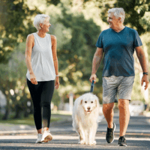 couple walking dog