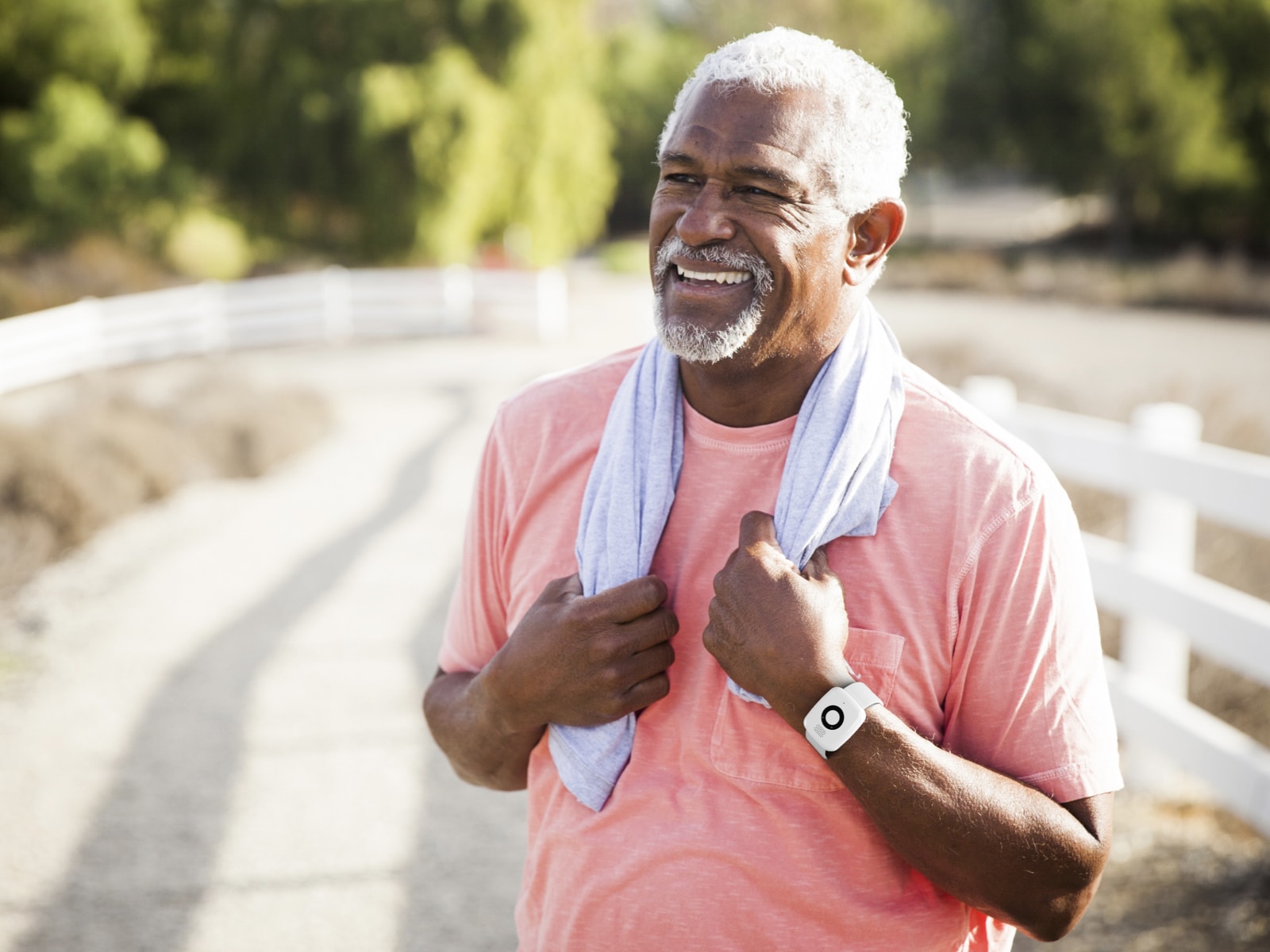 Man jogging while wearing Medical Alert Mini Mobile System
